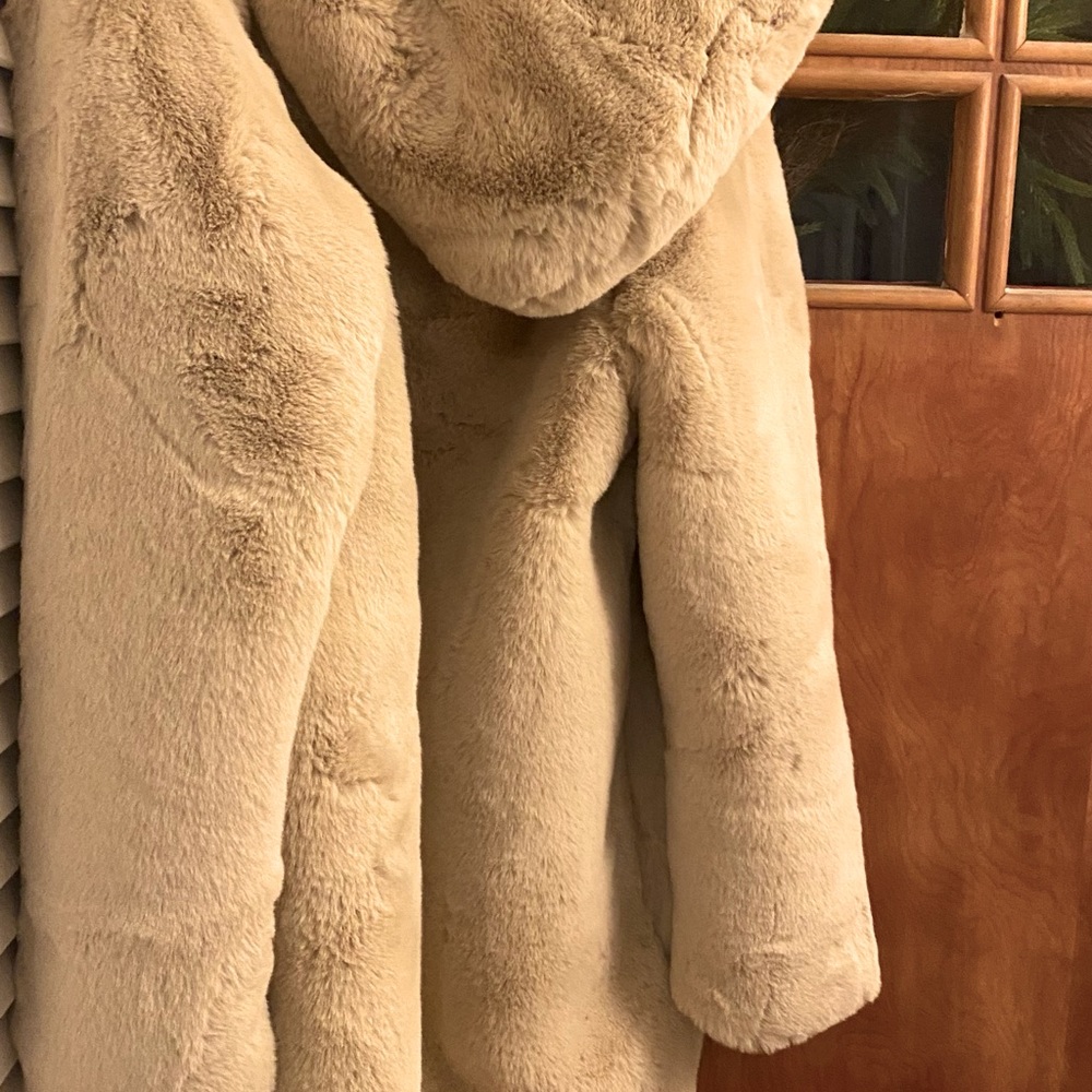 Worn once beautiful faux fur appraise jacket with eyelet closure and hood